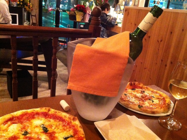For the main course, a bottle of white wine and two cheap, yet scrumptious pizzas. :D